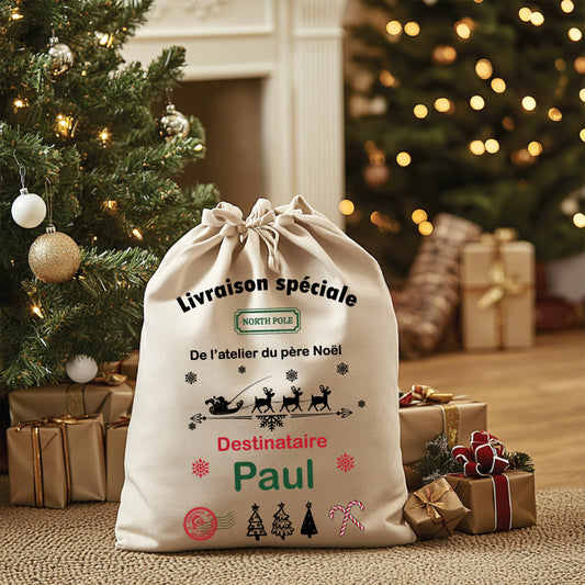 Sac de Noël en coton naturel, personnalisable avec un prénom ou un message, éco-responsable et réutilisable, idéal pour emballer les cadeaux.